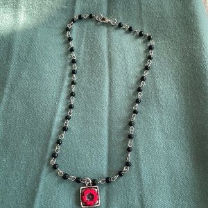 Black bead on silver chain necklace